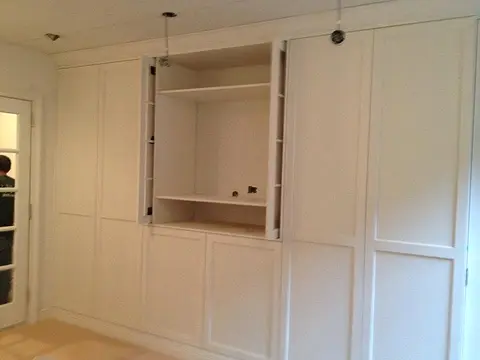 Paneled wall with TV niche